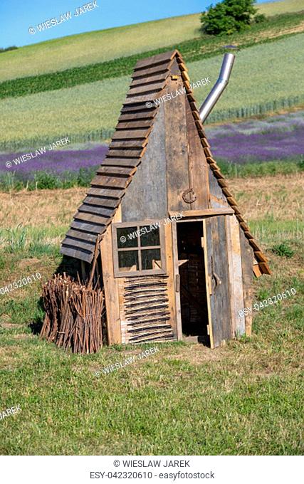 Ostrow, Poland - June 6, 2018: Small wooden hut in 'Garden full of lavender' arranged by Barbara and Andrzej Olender in Ostrów 40 km from Krakow