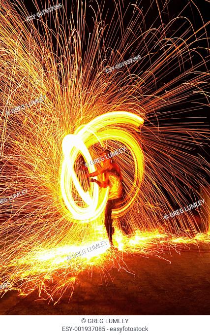 Firedancer surrounded by fire and sparks