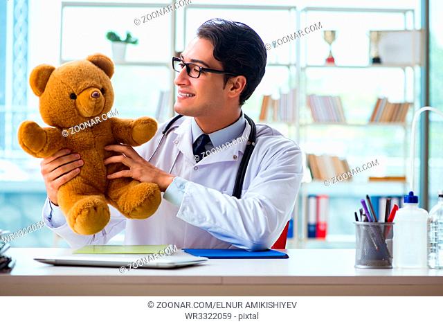 Pediatrician with toy sitting in the office