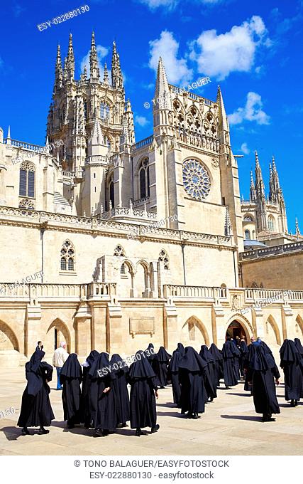 Burgos Cathedral facade in Saint James Way with unknown nuns at Castilla Leon of Spain