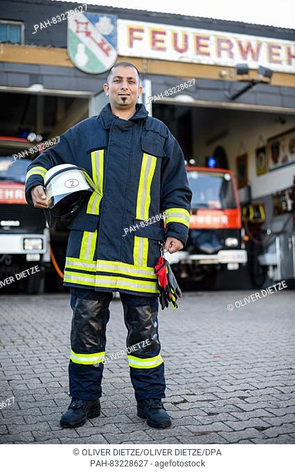 Fire brigade apprentice Nidal Almatar posing at the fire brigade in Orscholz, Germany, 24 August 2016. The 36-year-old Syrian has been a member of the voluntary...