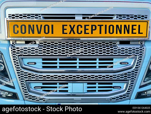 Tractor truck showing convoi exceptionnel sign or Oversize load. Blue arctic painted