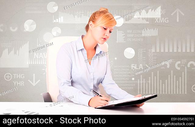 Business person sitting at desk with financial change, and report diagram concept
