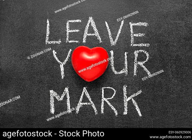 leave your mark phrase handwritten on blackboard with heart symbol instead O