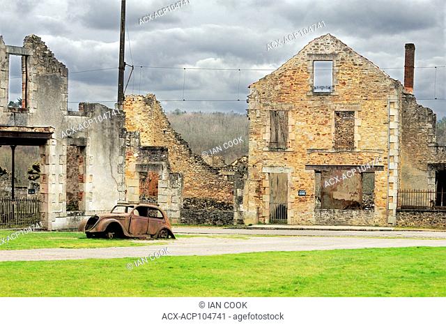 building ruins and remains of Peugeot 202 car, Oradour-sur-Glane, Haute-Vienne Department, Limousin, France