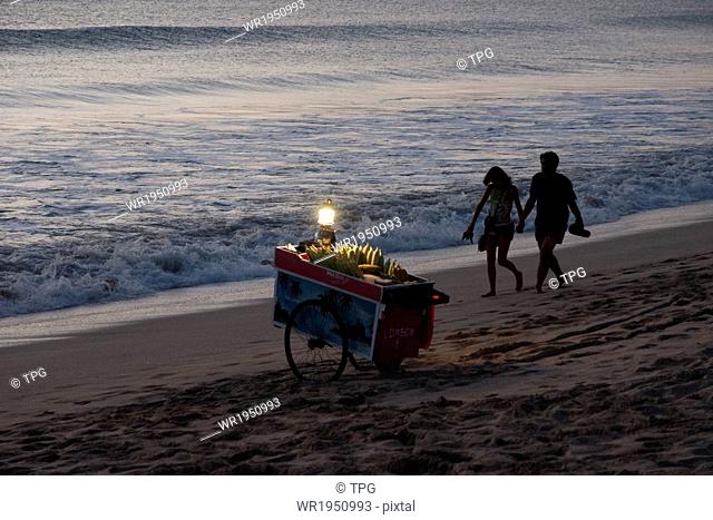 Young couple walking at beach in Bali, Indonesia