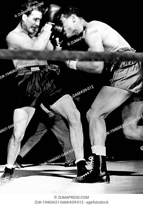 June 21, 1946 - New York, NY, U.S. - Boxing champion Joe Louis (L) vs. Billy Conn who fails to back up as Joe throws a punch