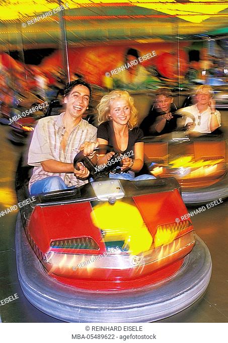 Couple on fairground in the bumper car