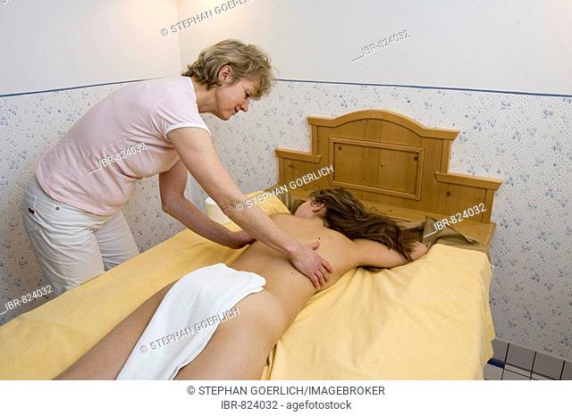 Young woman getting a massage at a spa