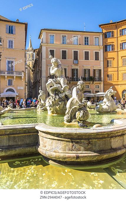 partial view of neptune fountain against the background of historic facades at piazza navona, rome, lazio, italy