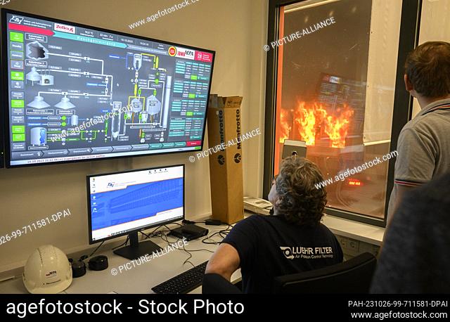 PRODUCTION - 10 October 2023, Lower Saxony, Brunswick: Employees sit in the control room of the Center for Fire Research (ZeBra) at Braunschweig Technical...