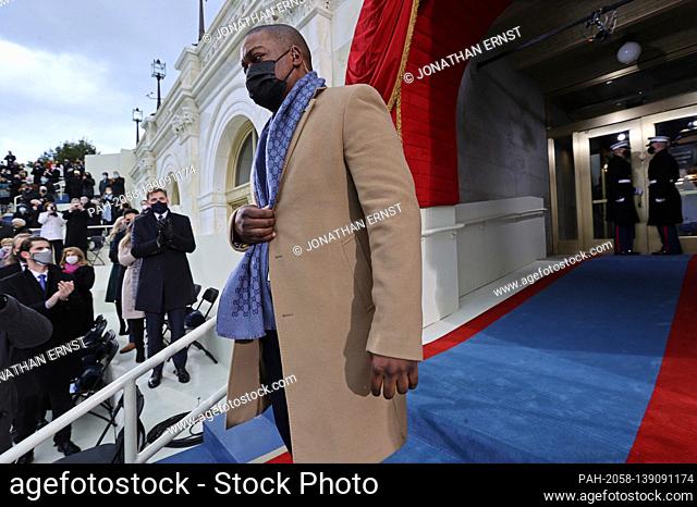 Officer Eugene Goodman named acting deputy sergeant of arms of the Capitol Police escorts Vice President-elect Kamala Harris as they arrive for the inauguration...