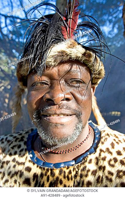 The Chief Biyela dressed with his ceremonial leopard skin . Simunye zulu village where visitors can be accomodated in zulu style