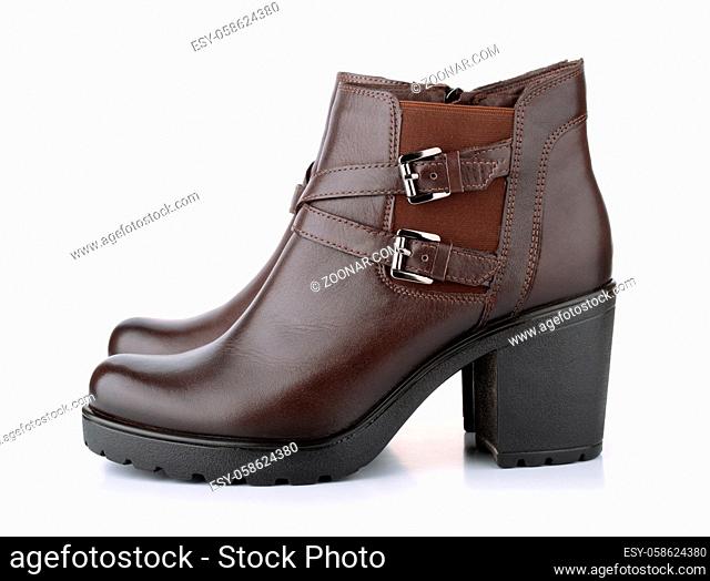 Side view of brown leather woman winter boots isolated on white