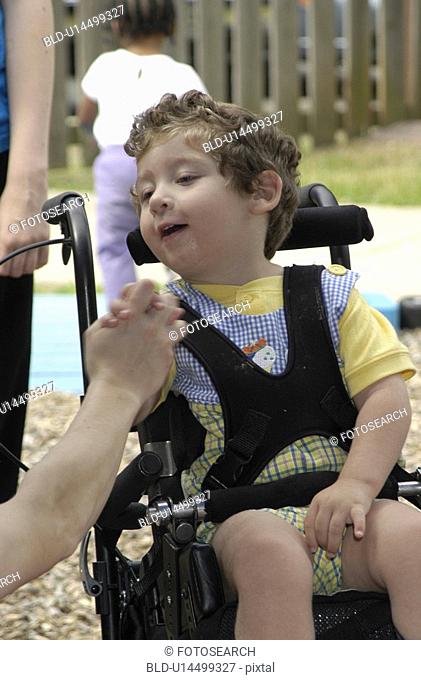 A tender moment in the life of a child with severe disabilities