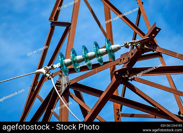 Glass prefabricated high voltage insulators on poles high-voltage power lines. Electrical industry