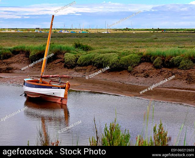 Boat on the calm water, Blakeney, North Norfolk coast, East Anglia. High quality photo