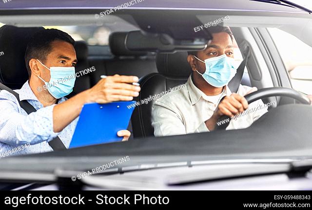 car driving school instructor and driver in mask