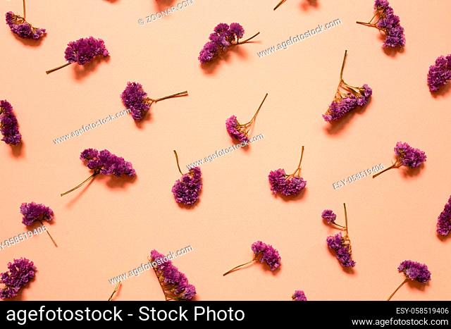Pink purple statice flowers pattern background. Floral composition, flat lay, top view