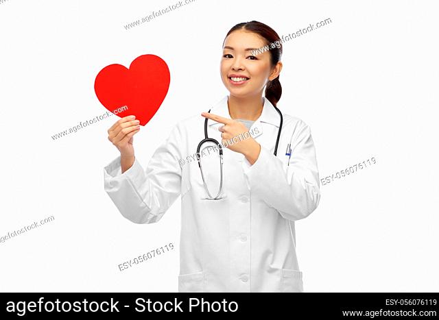 happy smiling asian female doctor with red heart