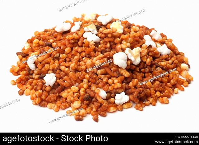 Roasted brown rice for japanese genmaicha tea on white background