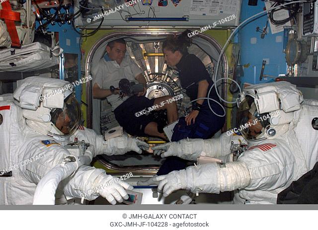 Astronauts David A. Wolf (left) and Piers J. Sellers, STS-112 mission specialists attired in their Extravehicular Mobility Unit (EMU) space suits