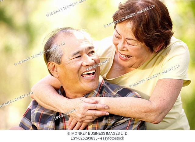 Portrait romantic senior Asian couple outdoors