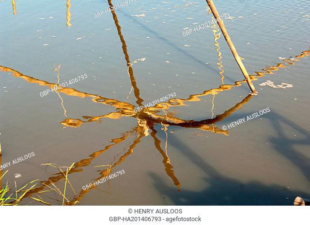 Shore-operated lift net - Reflections in the water - Southern Thailand, Asia - March 2014