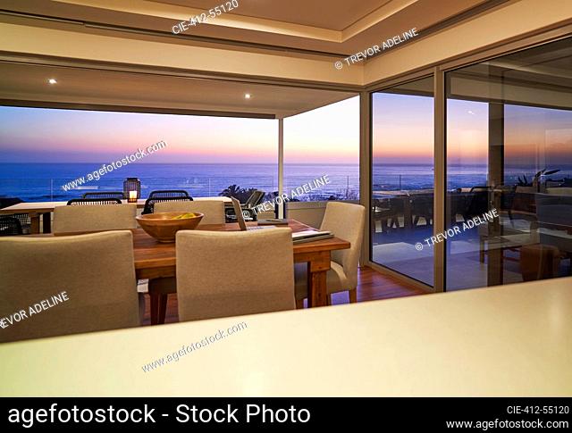 Scenic sunset ocean view from luxury modern home showcase interior