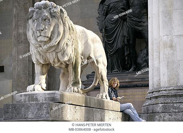 Germany, Bavaria, Munich, commander-hall, lion-statue, woman, young, sits