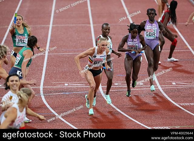 Belgian Cynthia Bolingo Mbongo hands out the relay to Belgian Hanne Claes the finals of the women's 4x400m relay race at the European Championships athletics