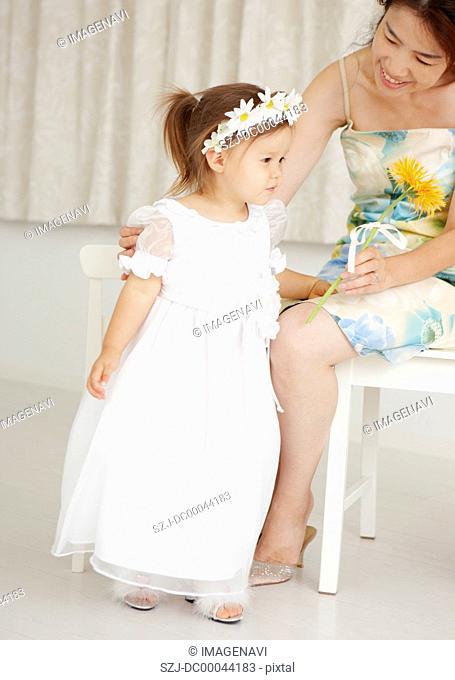 Girl in dress and her mother