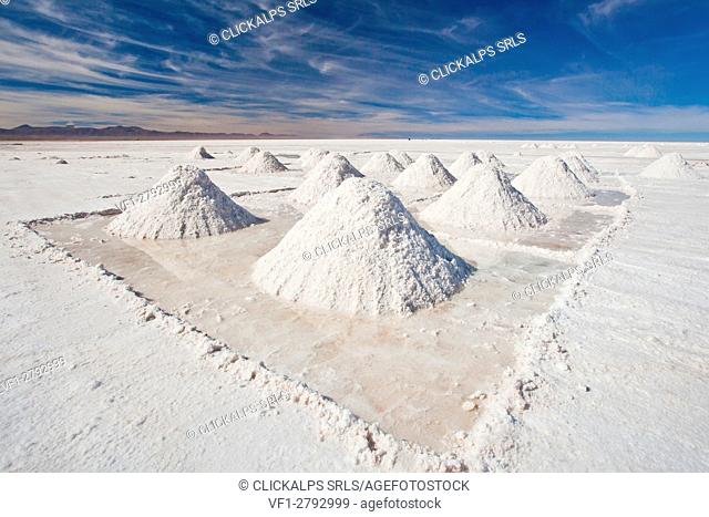 Pyramids of salt drying by Uyuni, a small village giving its name to the whole salt flat Bolivia South America