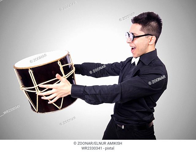 Funny man with drum on white