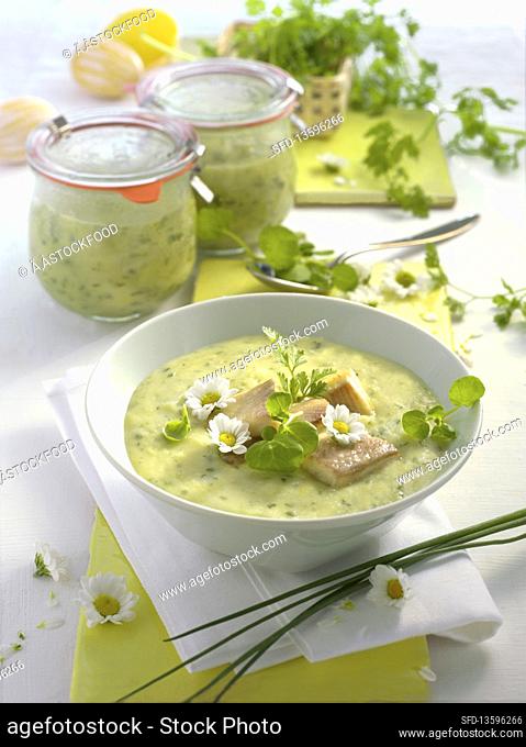 Preserved potato soup with herbs, served with smoked trout
