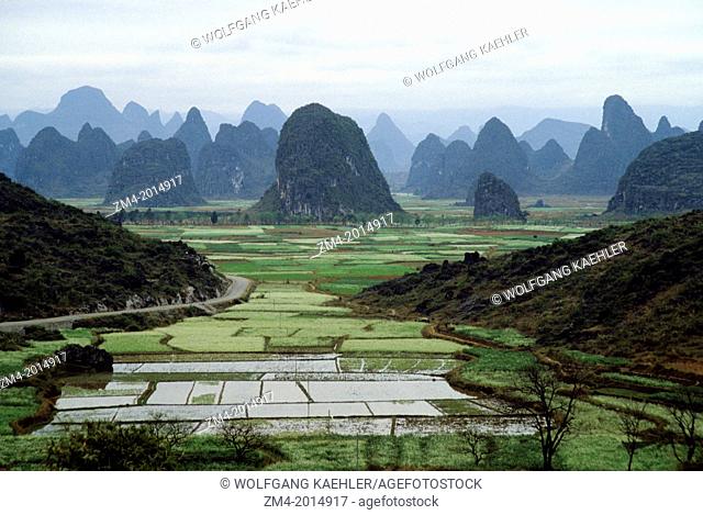 CHINA, NEAR GUILIN, VIEW OF LIME STONE MOUNTAINS WITH FIELDS NEAR THE LI RIVER