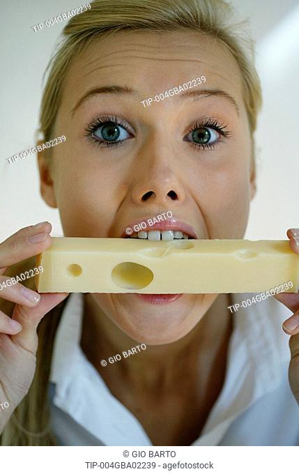 Woman eating cheese