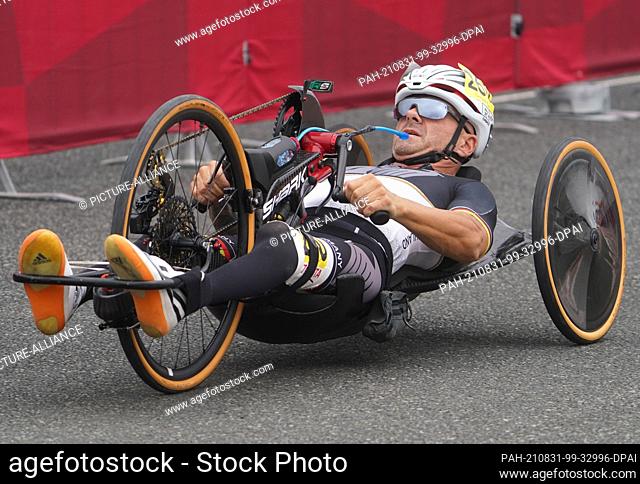 31 August 2021, Japan, Oyama: Paralympics: Para-cycling, men, time trial, Fuji International Speedway. Vico Merklein (Germany) in his handbike on the track