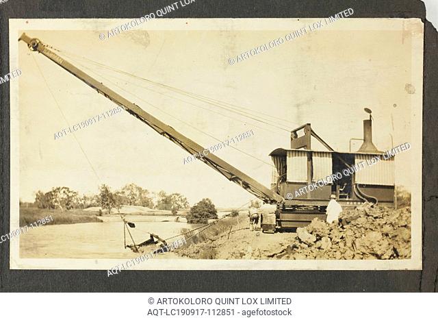 Photograph - A.T. Harman & Sons, Excavator Near a River, Victoria, circa 1923, One of five black and white photographs attached to an album page