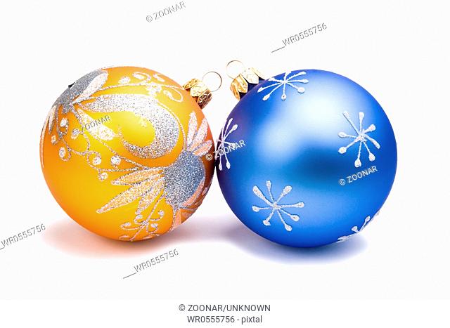 New Year Christmas spherical rounded blue and orange glass toys with painted snowflakes and abstract shapes