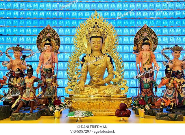 CANADA, SCARBOROUGH, 24.05.2015, Large gold plated statue of the Medicine Buddha (Bhaisajyaguru) on a shrine at the Jing Yin Buddhist Temple in Scarborough