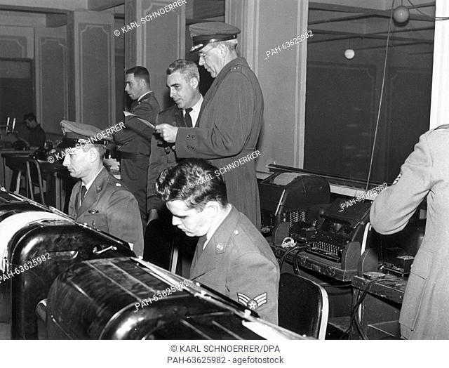 Major General George B. Dany in the telex room at Munich airfield on 21 December 1956 organising the airlift. Due to the put down of the Hungarian Uprising in...