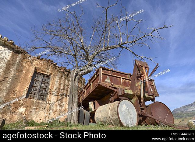ruined farmhouse with agricultural machinery in Casabermeja, Malaga. Spain