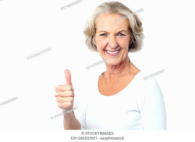 Image of a senior lady showing success gesture