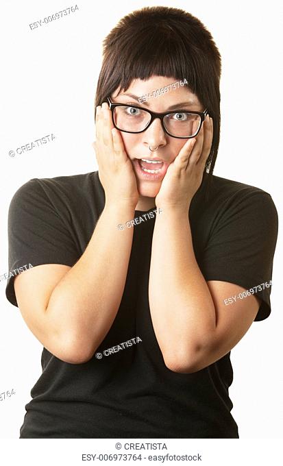 Overwhelmed young woman with hands on cheeks