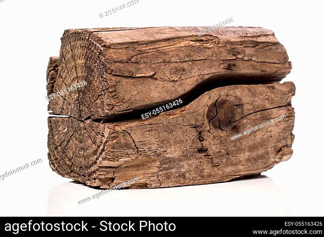 Cracked wooden brick on a white background