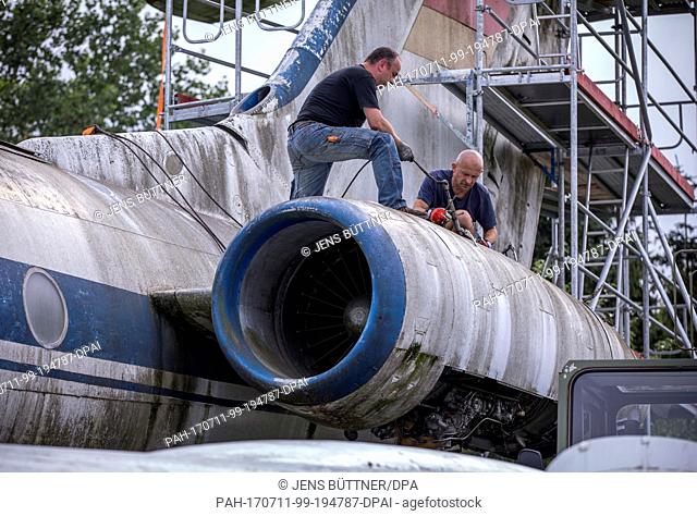 Cottbus Aviation Museum specialists prepare a Soviet Tupolev 134A passenger plane for dismantlement in Gruenz, Germany, 10 July 2017