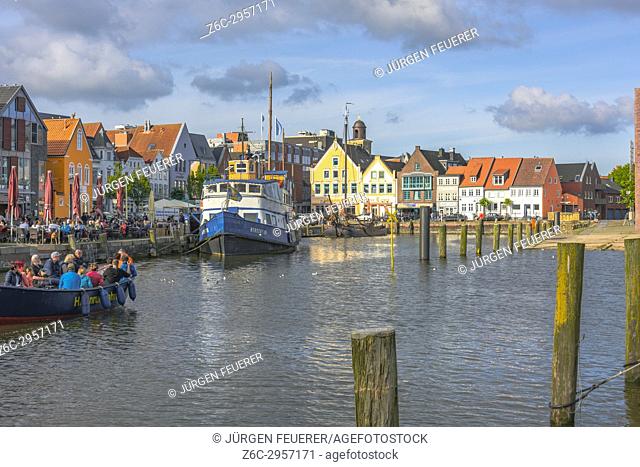 panorama view of inner harbour of Husum in sunset light, the coastal town at the North Sea, Germany
