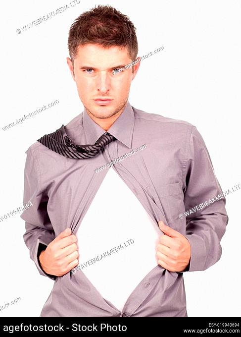 young attractive man pulling at his t-shirt