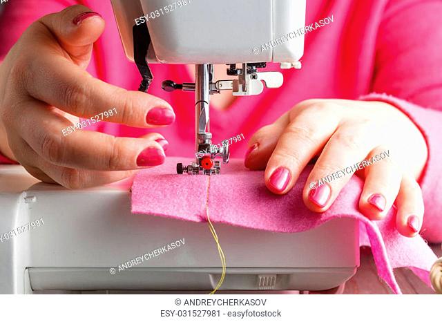 Tailor working on a sewing machine